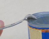 Punching a hole in a can