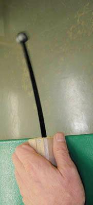 A steel strip serves as a spring