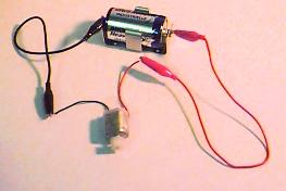 a circuit containing a motor and a battery