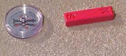 a compass points towards a magnet