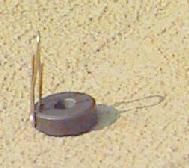 a magnet holds a paper clip