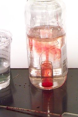 Warm red water moving into cool clear water